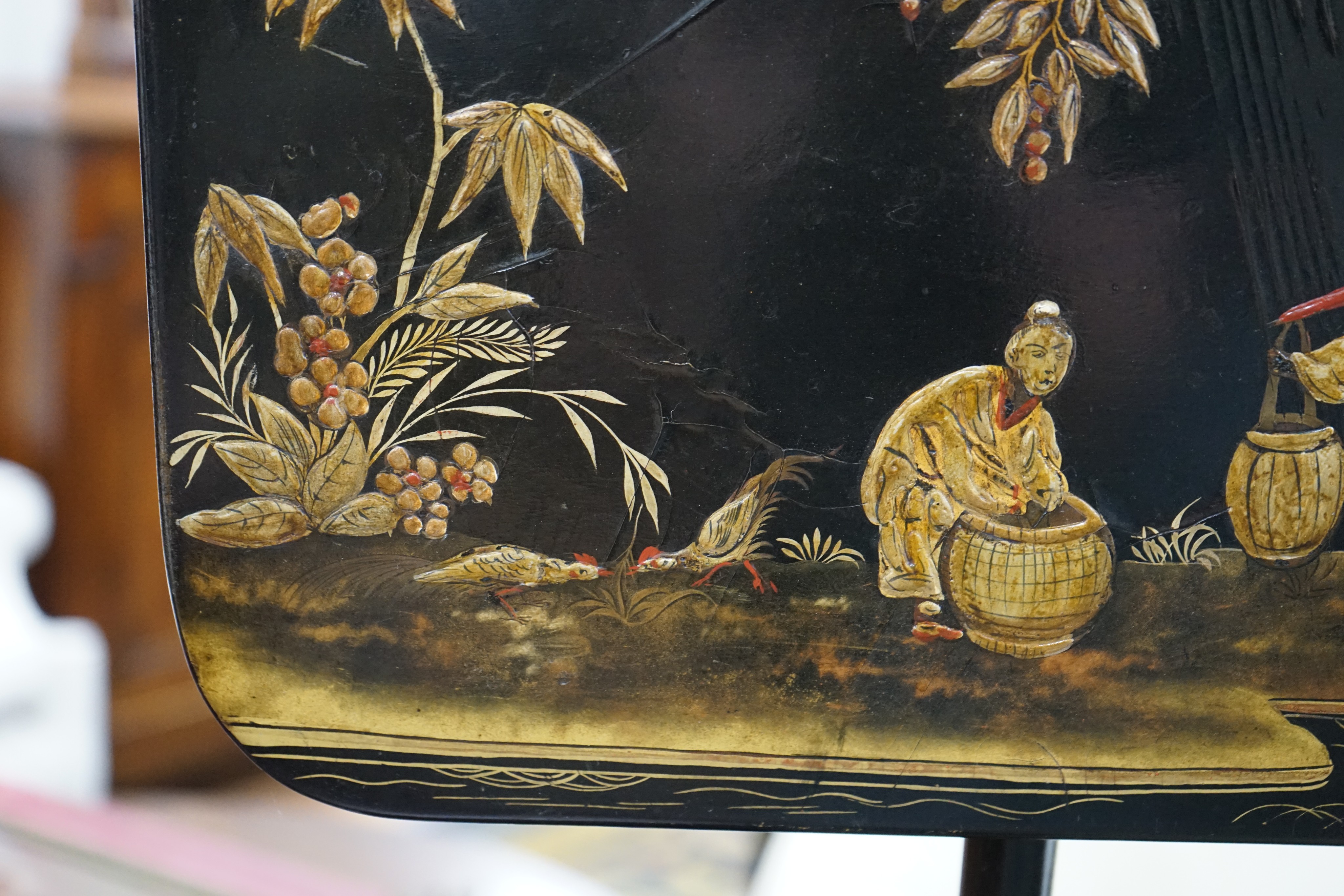 A pair of 19th century chinoiserie lacquer pole screens, height 152cm